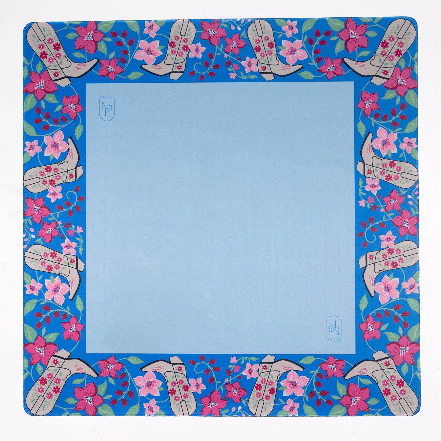Decorative mahjong mat with floral and boot pattern on a blue background