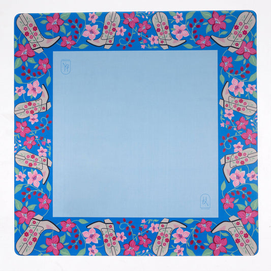 Decorative mahjong mat with floral and boot pattern on a blue background