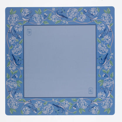 Blue mahjong mat with floral and bird design on a white background