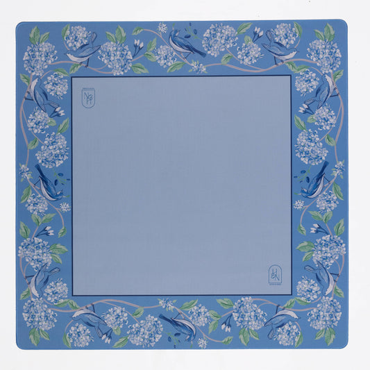 Blue mahjong mat with floral and bird design on a white background