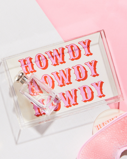 Clear acrylic tray with 'HOWDY' text on a pink background